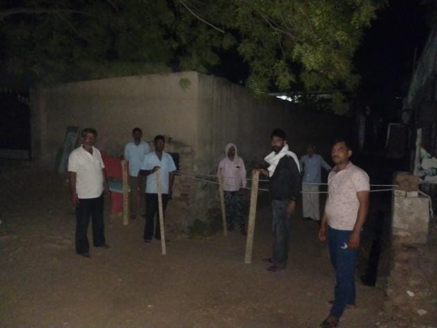 Villagers maintaining vigil to keep check on movement at a village in Haryana’s Rewari district.(HT PHOTO)