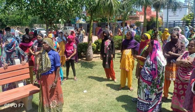 Women seeking ration gather outside the office of Zirakpur municipal corporation on Tuesday. (HT photo) Women seeking ration gather outside the office of Zirakpur municipal corporation on Tuesday. (HT photo)
