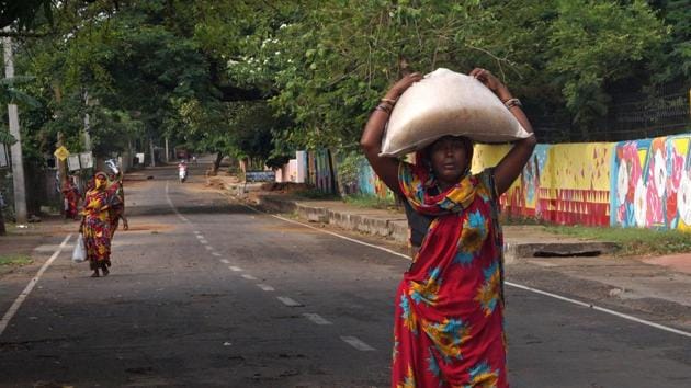 A worker carries ration from Public Distribution System centre during the nationwide Covid-19 lockdown, in Bhubaneswar on Sunday. (ANI Photo) A worker carries ration from Public Distribution System centre during the nationwide Covid-19 lockdown, in Bhubaneswar on Sunday. (ANI Photo)