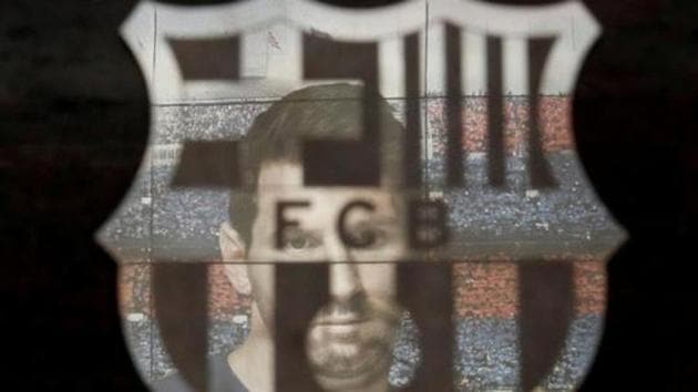 FILE PHOTO: Soccer Football - La Liga Santander - FC Barcelona v Real Sociedad - Camp Nou, Barcelona, Spain - March 7, 2020 A picture of Lionel Messi is reflected in the Barcelona emblem outside the stadium before the match REUTERS/Albert Gea/File Photo (REUTERS) FILE PHOTO: Soccer Football - La Liga Santander - FC Barcelona v Real Sociedad - Camp Nou, Barcelona, Spain - March 7, 2020 A picture of Lionel Messi is reflected in the Barcelona emblem outside the stadium before the match REUTERS/Albert Gea/File Photo (REUTERS)