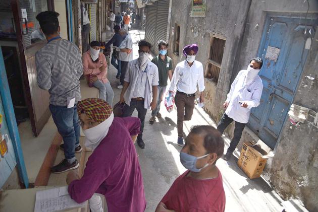 Rush of local residents at medical shops of Pindi Street in Ludhiana on Tuesday.(Gurpreet Singh)