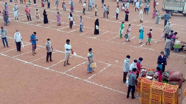 People stand in queues and maintain social distance while buying essential items in Vijayawada. (ANI) People stand in queues and maintain social distance while buying essential items in Vijayawada. (ANI)