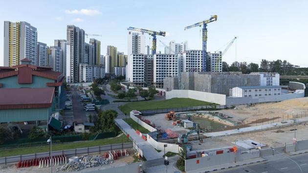 A housing construction site stands idle in the Punggol area of Singapore. National Development Minister Lawrence Wong said Sunday that many of the workers in the affected dormitories work in construction. (Wei Leng Tay / Bloomberg) A housing construction site stands idle in the Punggol area of Singapore. National Development Minister Lawrence Wong said Sunday that many of the workers in the affected dormitories work in construction. (Wei Leng Tay / Bloomberg)