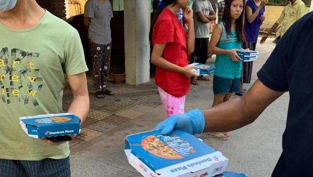 Apart from providing dry ration and essential items at their doorsteps, officials on Tuesday evening even arranged a pizza treat for 52 students from Arunachal Pradesh stranded in the district’s Dera Bassi subdivision. (HT PHOTO) Apart from providing dry ration and essential items at their doorsteps, officials on Tuesday evening even arranged a pizza treat for 52 students from Arunachal Pradesh stranded in the district’s Dera Bassi subdivision. (HT PHOTO)