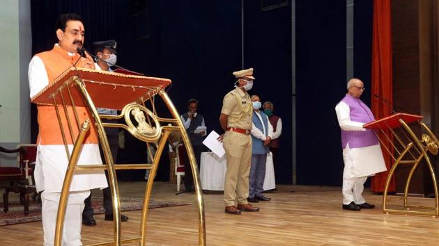 Madhya Pradesh Governor Lalji Tandon administers the oath of office and secrecy to Cabinet Minister Narottam Mishra during the swearing-in ceremony, at Raj Bhawan in Bhopal, Tuesday, April 21, 2020. (PTI) Madhya Pradesh Governor Lalji Tandon administers the oath of office and secrecy to Cabinet Minister Narottam Mishra during the swearing-in ceremony, at Raj Bhawan in Bhopal, Tuesday, April 21, 2020. (PTI)