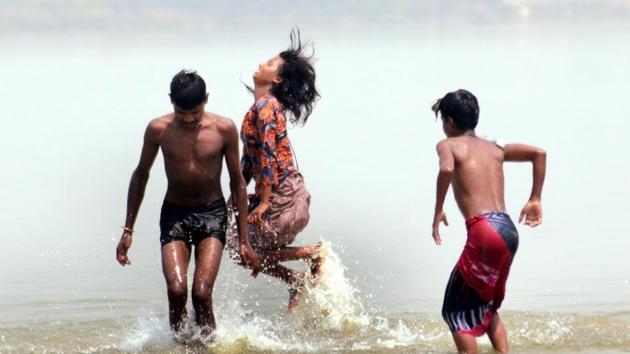 People enjoying in river Ganga during the lockdown in wake of coronavirus pandemic, in Patna, April 18, 2020.(ANI)