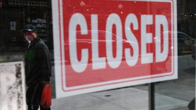 A store stands closed as the coronavirus keeps financial markets and businesses mostly closed on April 21, 2020 in New York City. (AFP) A store stands closed as the coronavirus keeps financial markets and businesses mostly closed on April 21, 2020 in New York City. (AFP)