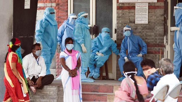 Health workers wearing personal protective equipment suits as a preventive measure against coronavirus at a Government Hospital in Vijayawada on Wednesday. (ANI Photo)(ANI)