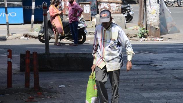 Senior citizen steps out to purchase essential things.There are currently 18,000 senior citizens on police records and the data is available with the SSC. (Ravindra Joshi/HT PHOTO) Senior citizen steps out to purchase essential things.There are currently 18,000 senior citizens on police records and the data is available with the SSC. (Ravindra Joshi/HT PHOTO)