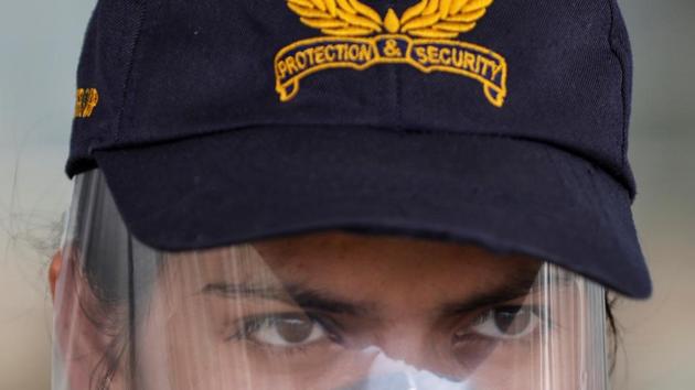 Covid-19: A member of Central Industrial Security Force (CISF) wearing a protective face shield keeps guard, during an extended nationwide lockdown to slow the spread of the coronavirus disease (Covid-19), at the Sardar Vallabhbhai Patel International (SVPI) airport in Ahmedabad.
