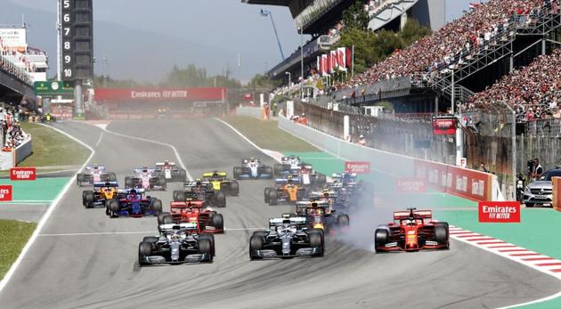 Mercedes driver Lewis Hamilton, left, of Britain leads the field after the start of the Spanish Formula One race. (AP) Mercedes driver Lewis Hamilton, left, of Britain leads the field after the start of the Spanish Formula One race. (AP)