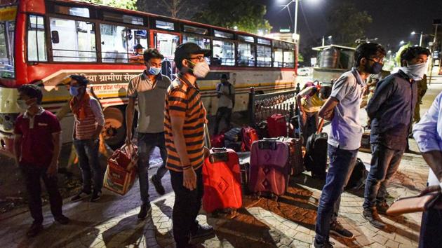 Stranded students from Kota alight the bus arranged by UP government as they arrive at their native place during the nationwide lockdown, imposed as a preventive measure against the coronavirus, in Prayagraj, Monday, April 20, 2020.(PTI) Stranded students from Kota alight the bus arranged by UP government as they arrive at their native place during the nationwide lockdown, imposed as a preventive measure against the coronavirus, in Prayagraj, Monday, April 20, 2020.(PTI)
