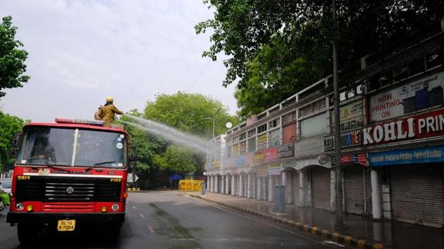 Delhi Fire Service truck to sanitize a near-empty Connaught Place during a lockdown imposed due to the coronavirus in New Delhi. (Bloomberg) Delhi Fire Service truck to sanitize a near-empty Connaught Place during a lockdown imposed due to the coronavirus in New Delhi. (Bloomberg)