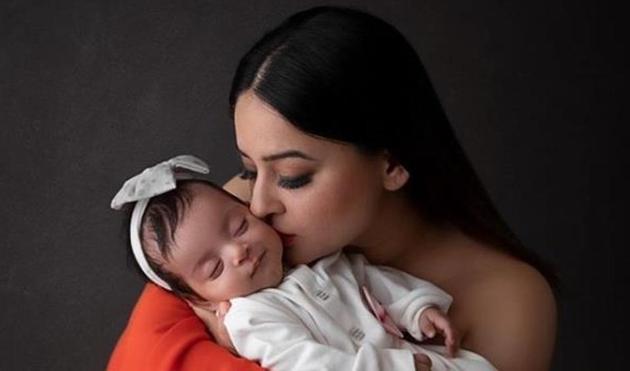 Mahhi Vij kisses her young daughter Tara. Mahhi Vij kisses her young daughter Tara.