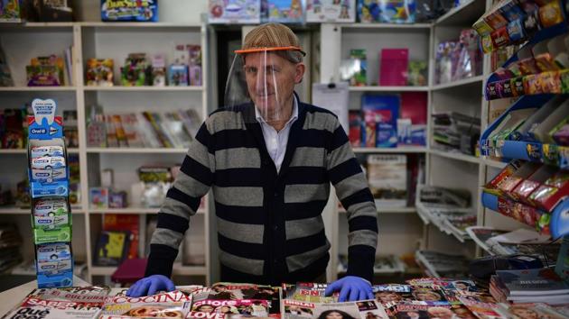 Antonio Leoz in his book shop. In the past few weeks, most retail stores including restaurants and bars, along with schools and other services have been closed to stem the COVID-19 outbreak that has infected over 190,000 people in Spain. (Alvaro Barrientos / AP)