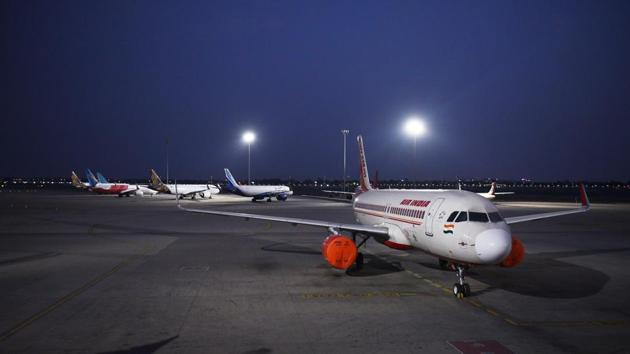 An Air India aircraft among others parked on the tarmac at Terminal 3 of the Indira Gandhi International (IGI) Airport during the lockdown, in New Delhi. IGI Airport -- which is the twelfth busiest in the word catering to roughly 69 million passengers annually, now only caters to cargo planes and aircraft ferrying foreigners seeking evacuation. (Vipin Kumar / HT Photo)