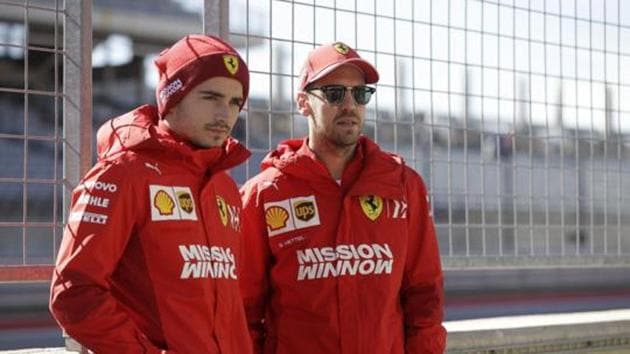 Ferrari driver Charles Leclerc, of Monaco, and Ferrari driver Sebastian Vettel, of Germany, pose for a photo during the Formula One U.S. Grand Prix.(AP)
