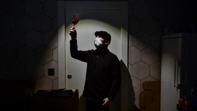 Javier Flamarique seen at his wine store in Pamplona. As Spain hunkers down after five weeks of confinement, the brave few keep the country going during a coronavirus outbreak that has killed more than 20,000 of their fellow citizens. (Alvaro Barrientos / AP)