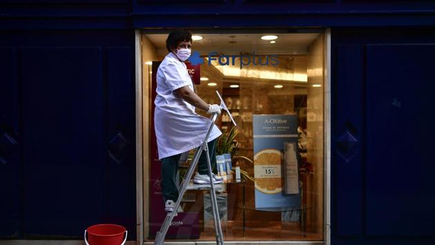Matilde Mattos of Peru poses for a photograph as she cleans windows. “This crisis is a way of showing us that we are destroying the planet. It is a sign from God,” Mattos told AP. (Alvaro Barrientos / AP)