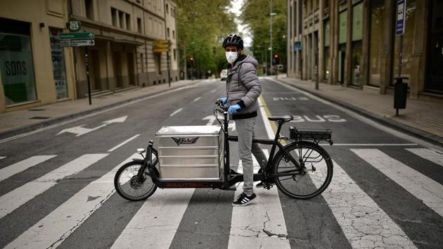 Sidi Hasan on his delivery bicycle. (Alvaro Barrientos / AP)