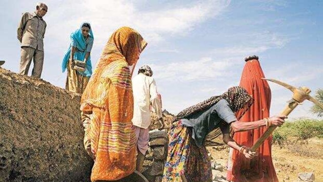 MGNREGS offers 100 days of work every year to at least one member of every rural household (HT) MGNREGS offers 100 days of work every year to at least one member of every rural household (HT)