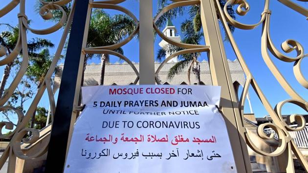A notice informs the closure of a mosque due to coronavirus on the first day of Ramzan in Sydney, Australia on April 24. Authorities in large parts of the world have continued lockdowns that prevent group gatherings and prayers in mosques keeping in mind the risk of contagion. (Saeed Khan / AFP) A notice informs the closure of a mosque due to coronavirus on the first day of Ramzan in Sydney, Australia on April 24. Authorities in large parts of the world have continued lockdowns that prevent group gatherings and prayers in mosques keeping in mind the risk of contagion. (Saeed Khan / AFP)
