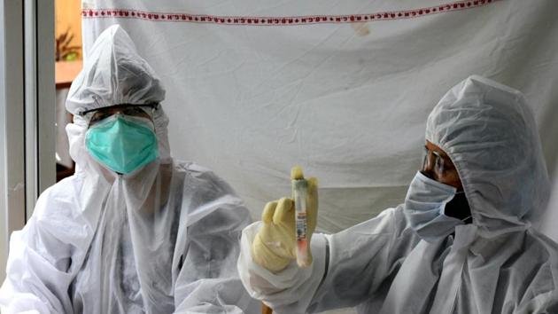 A medical worker holds samples from a Covid-19 test during a health camp at Patel Nagar in New Delhi India on Thursday.(Sonu Mehta/HT Photo) A medical worker holds samples from a Covid-19 test during a health camp at Patel Nagar in New Delhi India on Thursday.(Sonu Mehta/HT Photo)