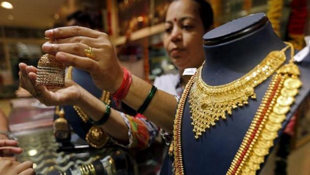 In the global market, gold eased on Friday as investors booked profits after a 1% rise in the previous session. (Reuters File Photo) In the global market, gold eased on Friday as investors booked profits after a 1% rise in the previous session. (Reuters File Photo)