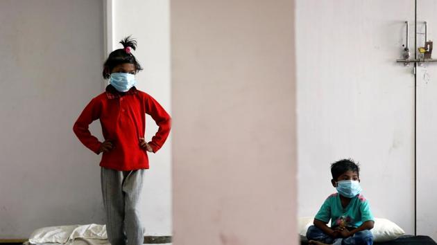 Children of migrant workers wear protective masks inside a sports complex turned into a shelter, during a 21-day nationwide lockdown to slow the spread of the coronavirus disease (Covid-19), in New Delhi. (REUTERS/Representative Photo)