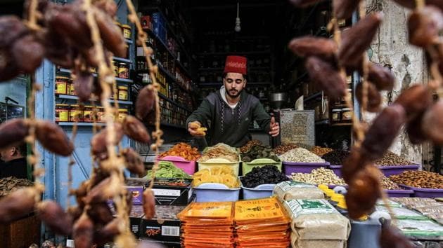 A view of a dried fruit merchant’s shop as people shop for supplies before the start of the Islamic holy month of Ramzan, in Khan Yunis, Gaza Strip on April 22. Believers fast from dawn to dusk and then gather around a family or community meal each evening of Islam’s holiest month. (Said Khatib / AFP) A view of a dried fruit merchant’s shop as people shop for supplies before the start of the Islamic holy month of Ramzan, in Khan Yunis, Gaza Strip on April 22. Believers fast from dawn to dusk and then gather around a family or community meal each evening of Islam’s holiest month. (Said Khatib / AFP)