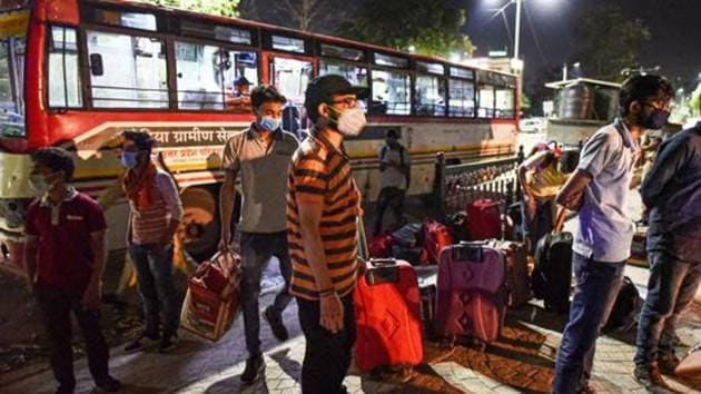 Prayagraj: Stranded students from Kota alight the bus arranged by UP government as they arrive at their native place during the nationwide lockdown, imposed as a preventive measure against the coronavirus, in Prayagraj on April 20, 2020. (PTI) Prayagraj: Stranded students from Kota alight the bus arranged by UP government as they arrive at their native place during the nationwide lockdown, imposed as a preventive measure against the coronavirus, in Prayagraj on April 20, 2020. (PTI)