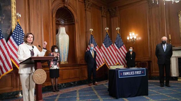 US House Speaker Nancy Pelosi speaks to the press before signing the additional 484 billion dollar relief package amid the coronavirus pandemic . The House of Representatives passed a new $483 billion economic stimulus bill April 23, 2020 as US job losses due to the coronavirus soared and businesses clamored for more support. (AFP) US House Speaker Nancy Pelosi speaks to the press before signing the additional 484 billion dollar relief package amid the coronavirus pandemic . The House of Representatives passed a new $483 billion economic stimulus bill April 23, 2020 as US job losses due to the coronavirus soared and businesses clamored for more support. (AFP)