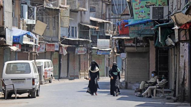 Women pass through the deserted street during nationwide lockdown amid concerns about the spreading of coronavirus disease, in Ahmedabad on Thursday. (ANI Photo) Women pass through the deserted street during nationwide lockdown amid concerns about the spreading of coronavirus disease, in Ahmedabad on Thursday. (ANI Photo)