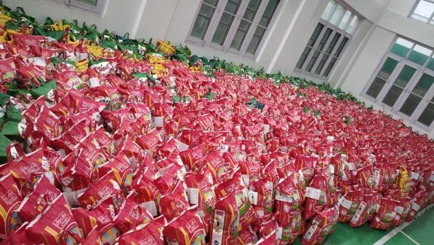 Each kit contains 5kg of rice and 2kg of wheat and a packet each of edible oil, tea and spices. (HT Photo) Each kit contains 5kg of rice and 2kg of wheat and a packet each of edible oil, tea and spices. (HT Photo)