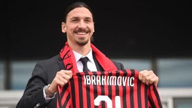 Zlatan Ibrahimovic holds up his AC Milan shirt after signing for the club. (REUTERS) Zlatan Ibrahimovic holds up his AC Milan shirt after signing for the club. (REUTERS)