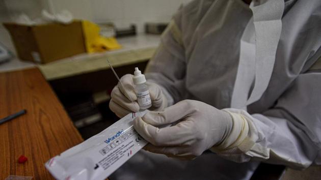 A health worker shows a Covid-19 antibody rapid testing kit at a dispensary in Delhi . (Biplov Bhuyan/HT PHOTO) A health worker shows a Covid-19 antibody rapid testing kit at a dispensary in Delhi . (Biplov Bhuyan/HT PHOTO)