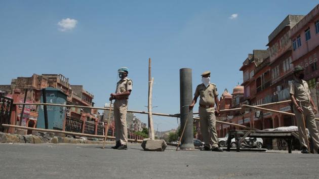 Police personnel on guard during lockdown in the Ramganj containment zone, in Jaipur, Rajasthan, Friday April 24, 2020. (Himanshu Vyas / HT Photo) Police personnel on guard during lockdown in the Ramganj containment zone, in Jaipur, Rajasthan, Friday April 24, 2020. (Himanshu Vyas / HT Photo)