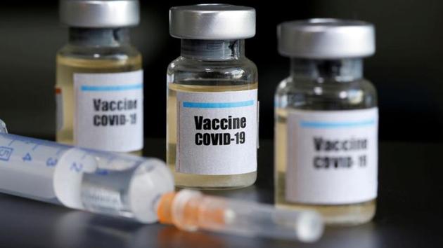 Small bottles labelled with a "Vaccine COVID-19" sticker and a medical syringe. (Reuters File Photo) Small bottles labelled with a "Vaccine COVID-19" sticker and a medical syringe. (Reuters File Photo)
