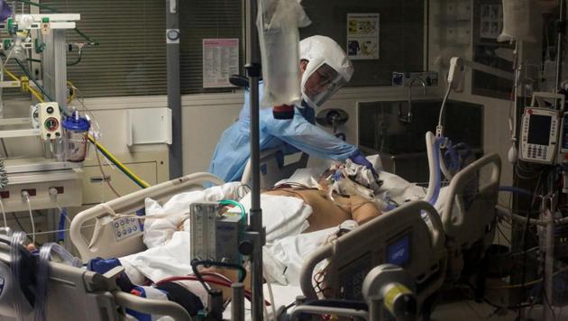 Nurse Leah Silver cares for a coronavirus disease patient in the Covid ICU at the University of Washington Medical Center - Montlake. (Reuters Photo) Nurse Leah Silver cares for a coronavirus disease patient in the Covid ICU at the University of Washington Medical Center - Montlake. (Reuters Photo)