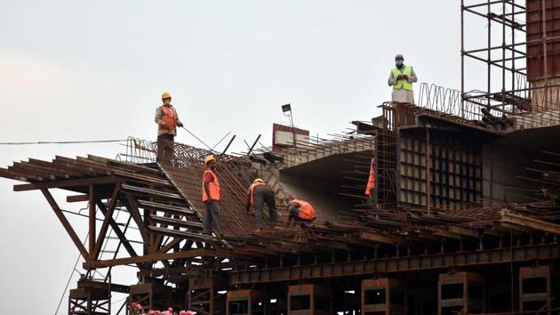 Labourers working on an under construction flyover after relaxations in lockdown conditions at Bailey road in Patna, Bihar (Parwaz Khan/HT Photo) Labourers working on an under construction flyover after relaxations in lockdown conditions at Bailey road in Patna, Bihar (Parwaz Khan/HT Photo)