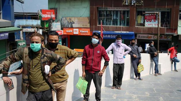 People wearing masks stand in a queue to buy vegetable in Gangtok during the lockdown to contain the spread of coronavirus. (ANI) People wearing masks stand in a queue to buy vegetable in Gangtok during the lockdown to contain the spread of coronavirus. (ANI)