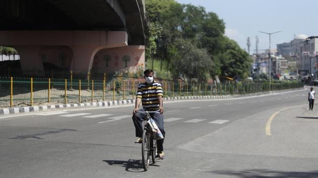 A man rides a bicycle on a deserted road during lockdown in Jammu, Friday, April 24, 2020. (AP / Photo used for representational purpose only) A man rides a bicycle on a deserted road during lockdown in Jammu, Friday, April 24, 2020. (AP / Photo used for representational purpose only)