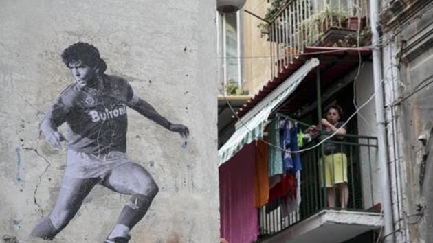A mural by Argentine artist Santiago Spiga alias "Spiga" depicts Argentine former football player Diego Armando Maradona. (Getty Images) A mural by Argentine artist Santiago Spiga alias "Spiga" depicts Argentine former football player Diego Armando Maradona. (Getty Images)