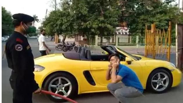 The image shows a security man making the man do sit ups. (Screengrab) The image shows a security man making the man do sit ups. (Screengrab)