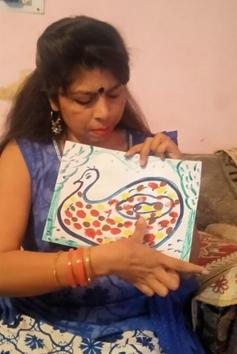 Harjit Kaur, an inclusive education resource teacher from Khanna, showing how to make a thumb painting. (HT Photo) Harjit Kaur, an inclusive education resource teacher from Khanna, showing how to make a thumb painting. (HT Photo)