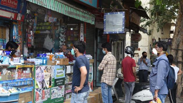People in a queue, maintaining social distancing, at a shop during lockdown in Gole Market, New Delhi, Saturday, April 25, 2020.(Arvind Yadav/HT PHOTO) People in a queue, maintaining social distancing, at a shop during lockdown in Gole Market, New Delhi, Saturday, April 25, 2020.(Arvind Yadav/HT PHOTO)