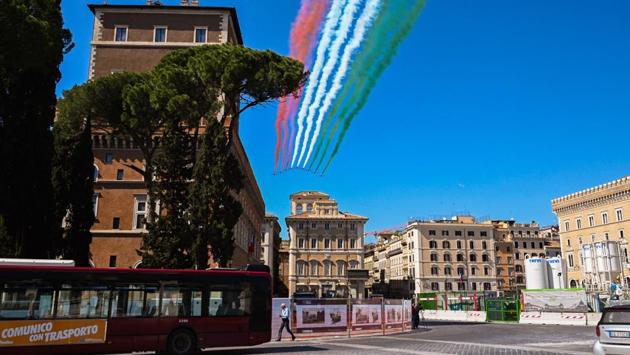 The Italian Air Force aerobatic unit Frecce Tricolori (Tricolor Arrows) perform on April 25 over Piazza Venezia in Rome , on the 75th anniversary of Liberation Day, which marks the fall of Nazi occupation in 1945, during the country's lockdown aimed at curbing the spread of the COVID-19 infection. (Tiziana Fabi / AFP)