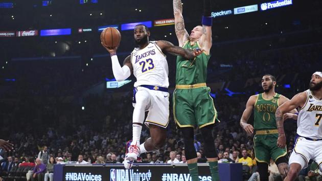 Los Angeles Lakers forward LeBron James (23) passes the ball under pressure from Boston Celtics center Daniel Theis (27) in the first half at Staples Center.(USA TODAY Sports) Los Angeles Lakers forward LeBron James (23) passes the ball under pressure from Boston Celtics center Daniel Theis (27) in the first half at Staples Center.(USA TODAY Sports)