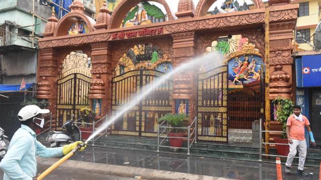 A municipal corporation worker sanitizes a temple on Purulia Road during lockdown to curb spread of coronavirus, in Ranchi, on Saturday, April 25, 2020. (Diwakar Prasad / HT Photo) A municipal corporation worker sanitizes a temple on Purulia Road during lockdown to curb spread of coronavirus, in Ranchi, on Saturday, April 25, 2020. (Diwakar Prasad / HT Photo)