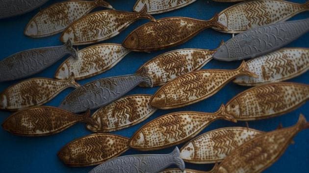 Rusted fish sculptures hang on the wall of a closed restaurant in the port of Frioul. Anthony Fabre runs the archipelago’s only food shop. “We are a closed-off population,” Fabre told AP. “I can give people the supplies they need so they don’t have to go to the mainland and risk getting sick.” (Daniel Cole / AP) Rusted fish sculptures hang on the wall of a closed restaurant in the port of Frioul. Anthony Fabre runs the archipelago’s only food shop. “We are a closed-off population,” Fabre told AP. “I can give people the supplies they need so they don’t have to go to the mainland and risk getting sick.” (Daniel Cole / AP)